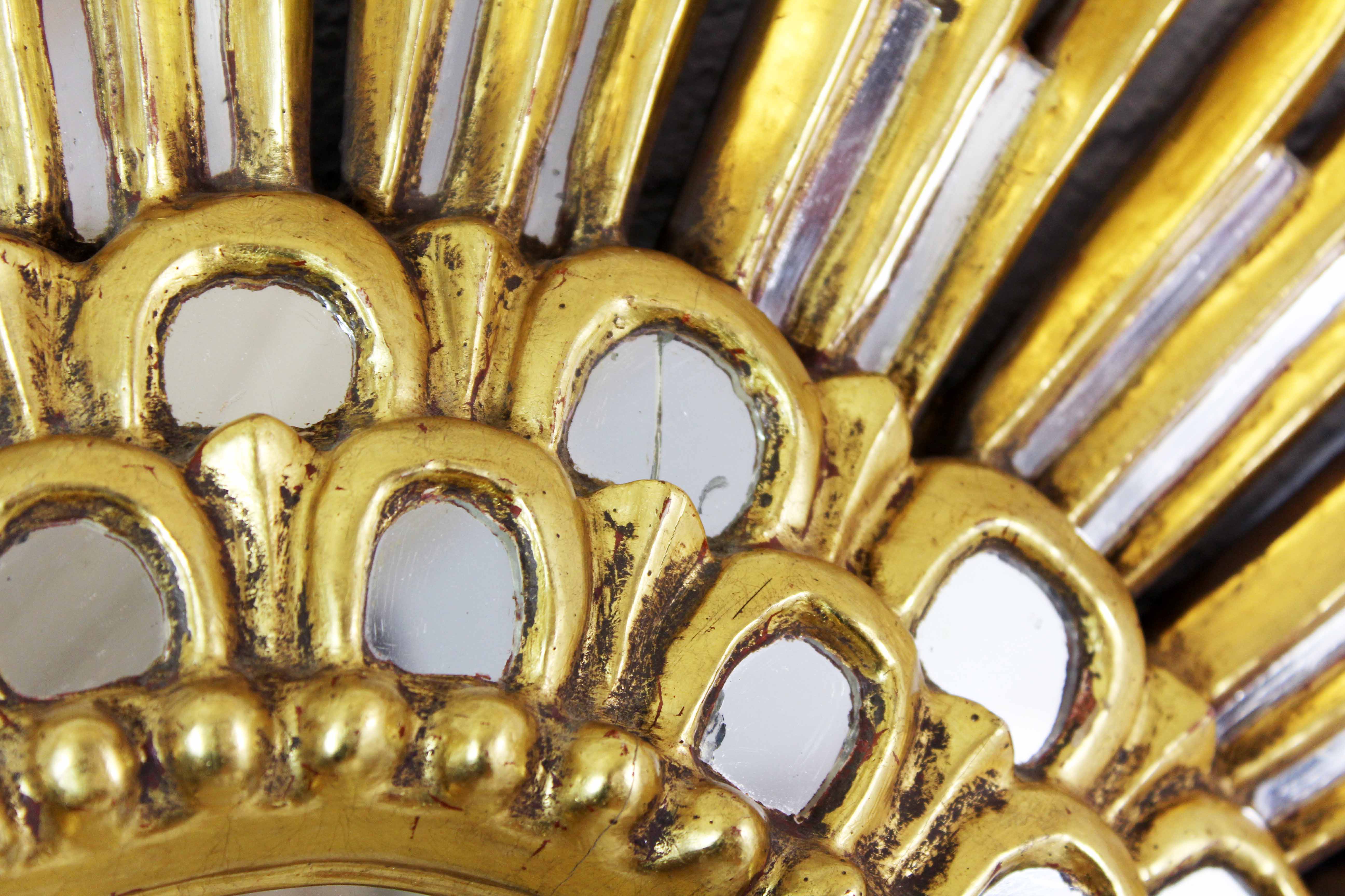 Sun mirror in wood and gilded stucco