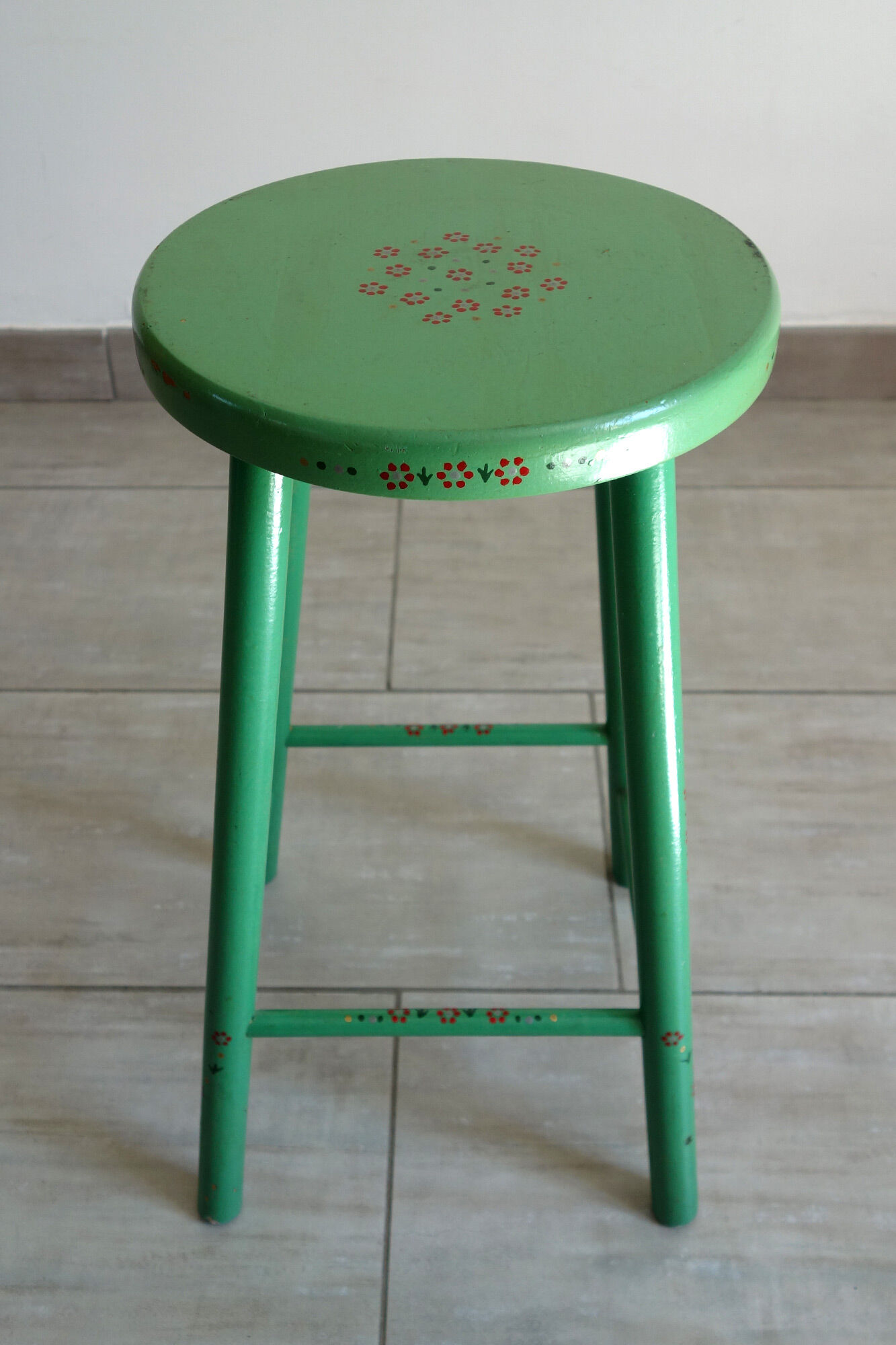 Old painted and decorated wooden stool