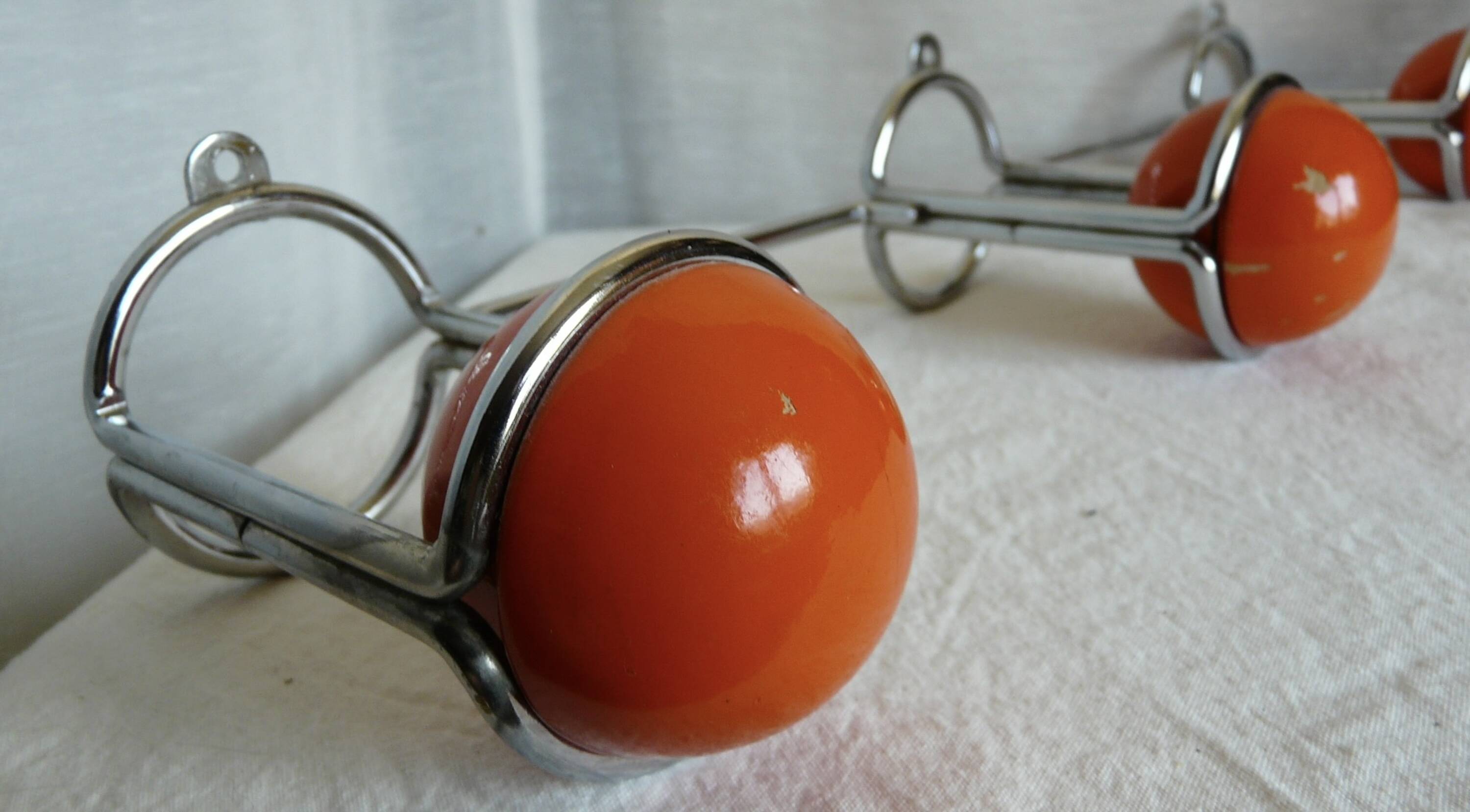 Vintage 1970s orange and chrome coat rack