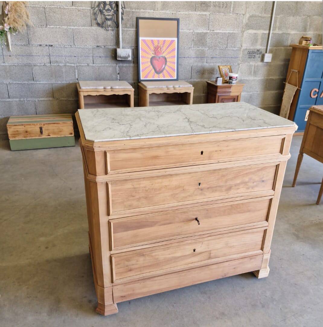 Walnut chest of drawers with white marble.
