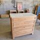Walnut chest of drawers with white marble.