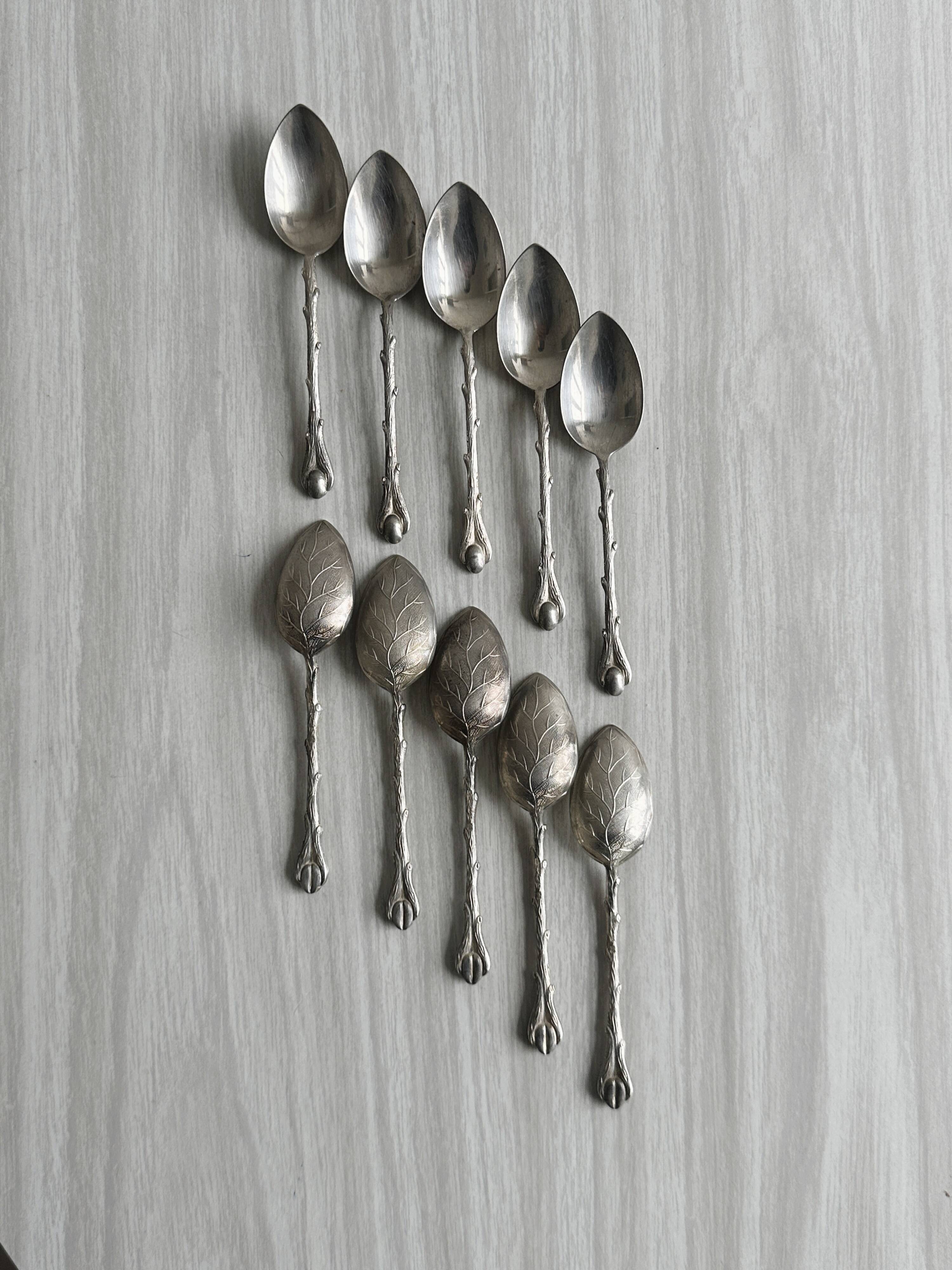 Set of 10 small silver metal spoons