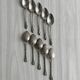 Set of 10 small silver metal spoons