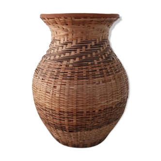 Vintage vase in sandstone and straw wicker