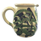 Antique pitcher of mixed earth