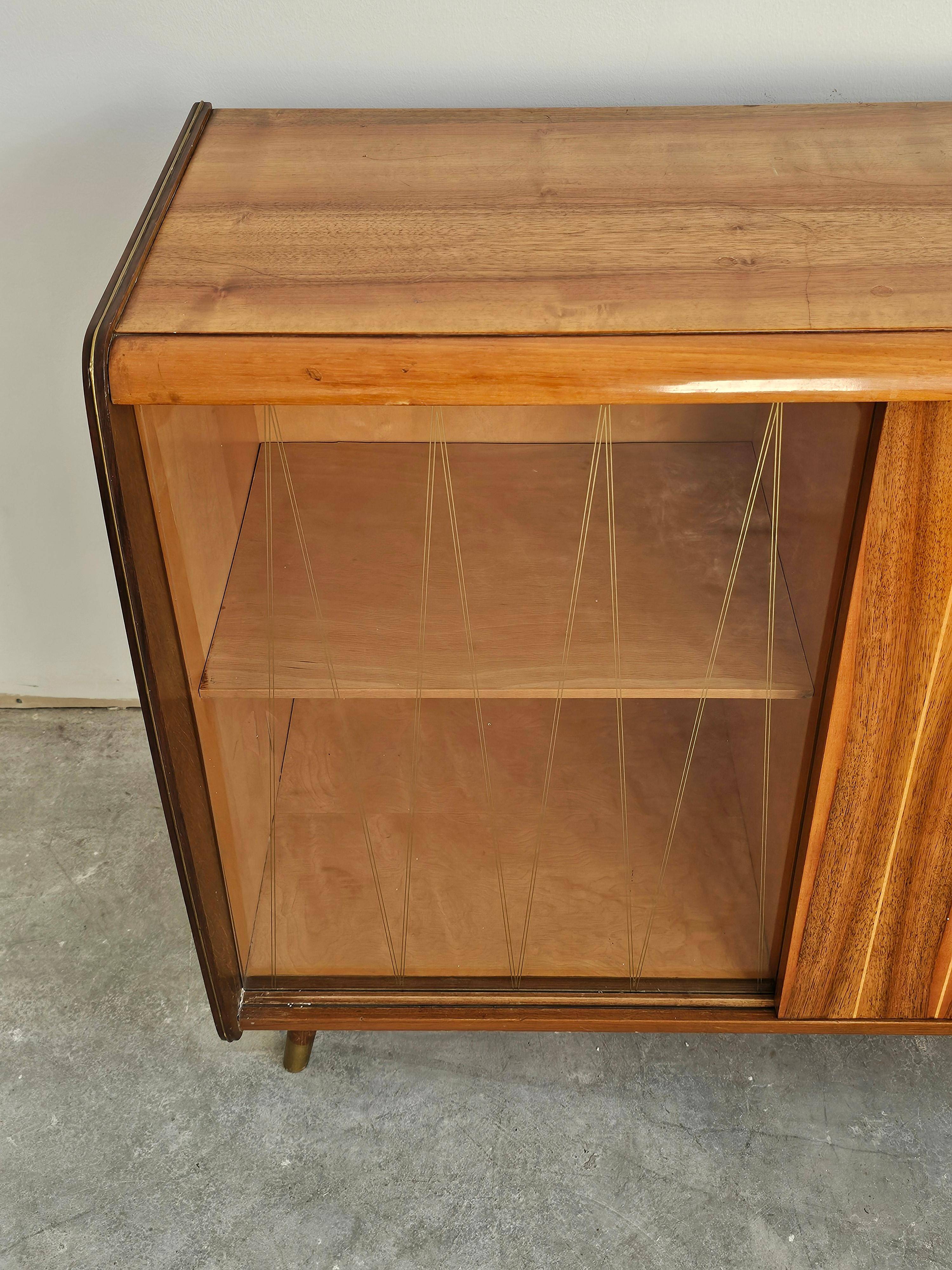 Mid-Century Modern walnut buffet with two compartments.