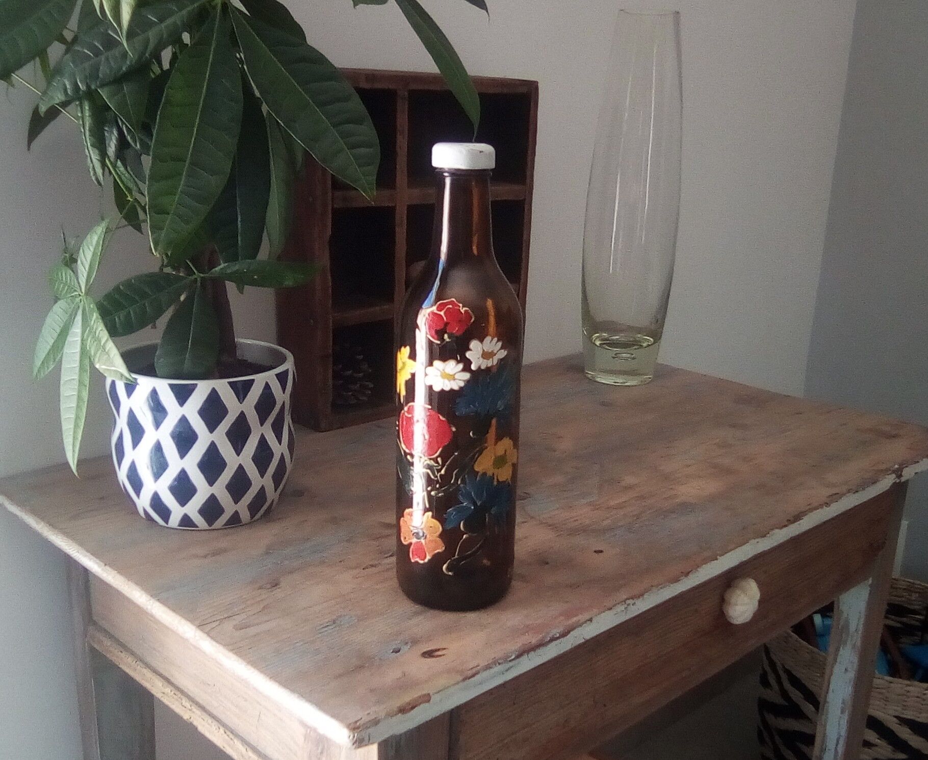 Vintage hand-painted amber glass bottle