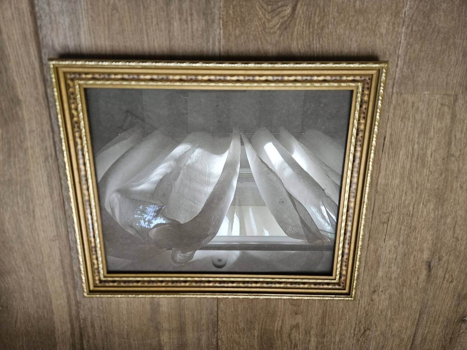 Golden wooden frame with floral patterns