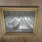 Golden wooden frame with floral patterns