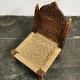 Ancient ethnic chair made of solid wood and rope