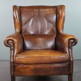 Dark wingback armchair made of sheep leather with stunning colors