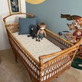 Vintage rattan baby bed with wheels