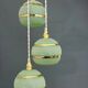 Suspension triple vintage glass globes in frosted green and gold.
