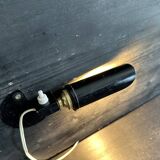 Old black metal and brass wall light, adjustable, 1930s.