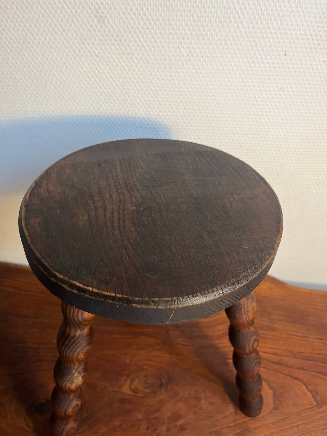 Round wooden tripod stool