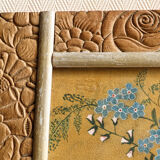 Bouquet of flowers in carved art deco frame