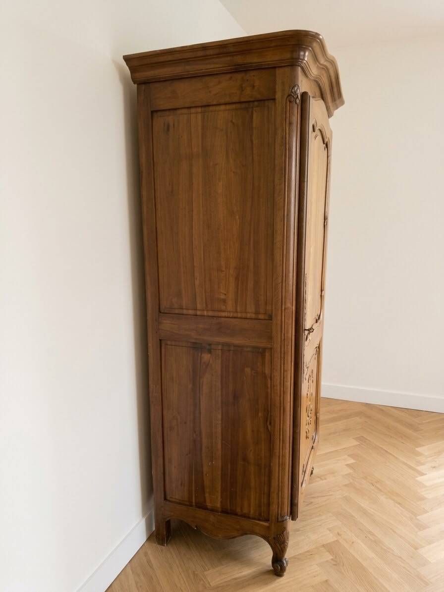 Antique wardrobe in classic style made of solid wood.