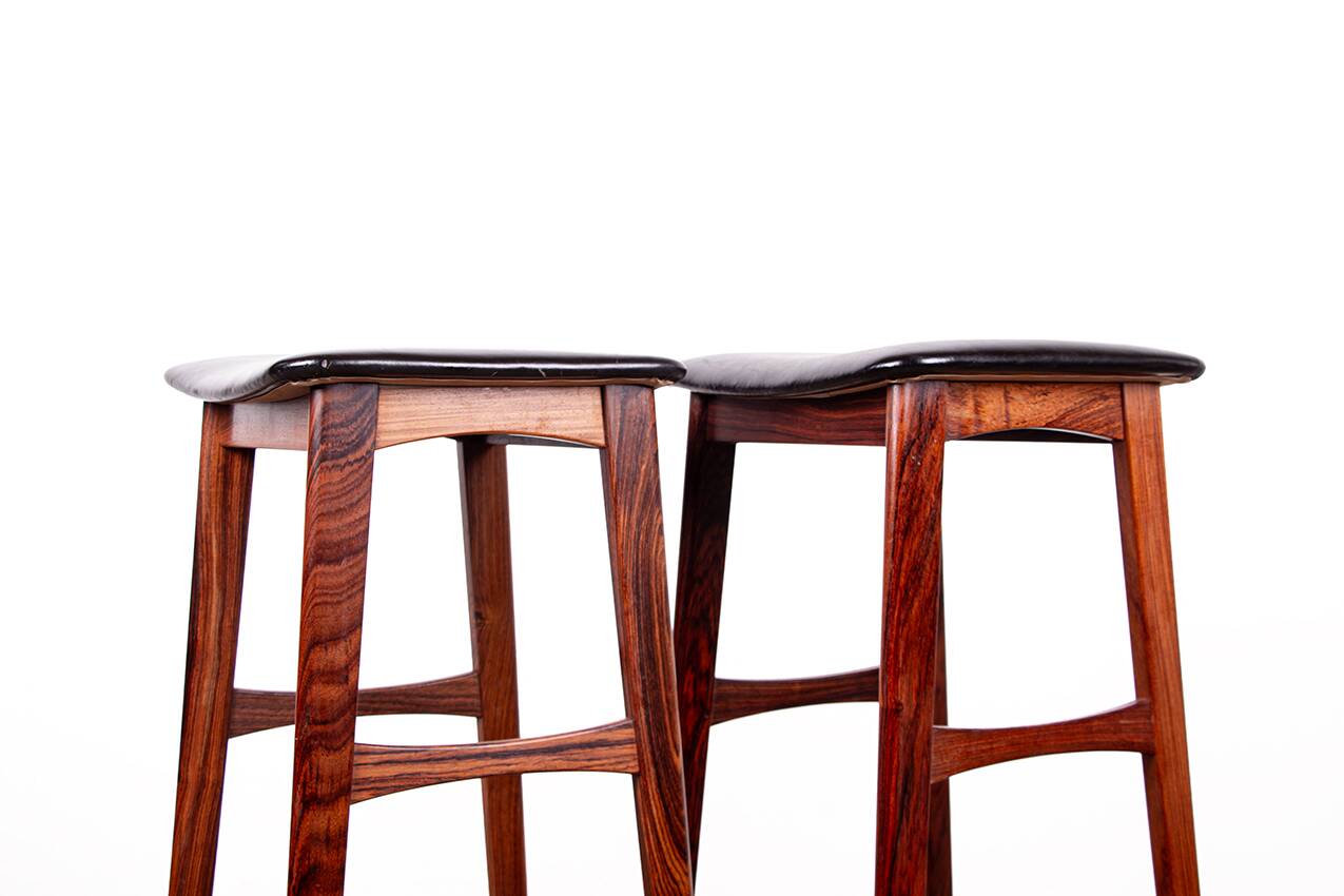 4 Danish high stools, rosewood and black leather, Knud Bent for Dyrlund.
