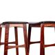 4 Danish high stools, rosewood and black leather, Knud Bent for Dyrlund.