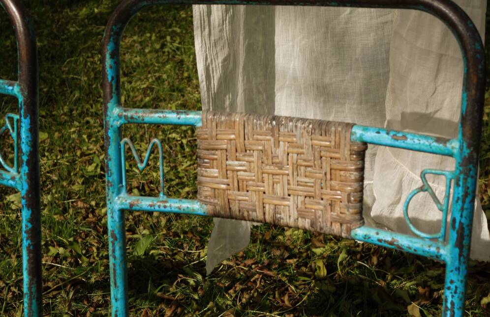 Wrought iron and rattan garden chairs