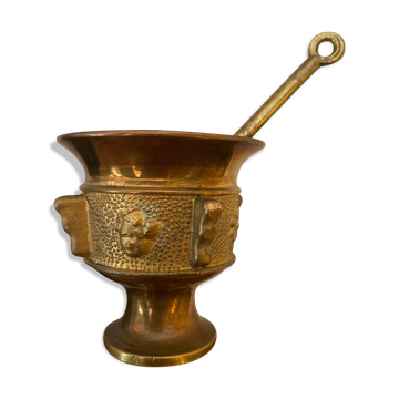 Old mortar and its bronze pillon