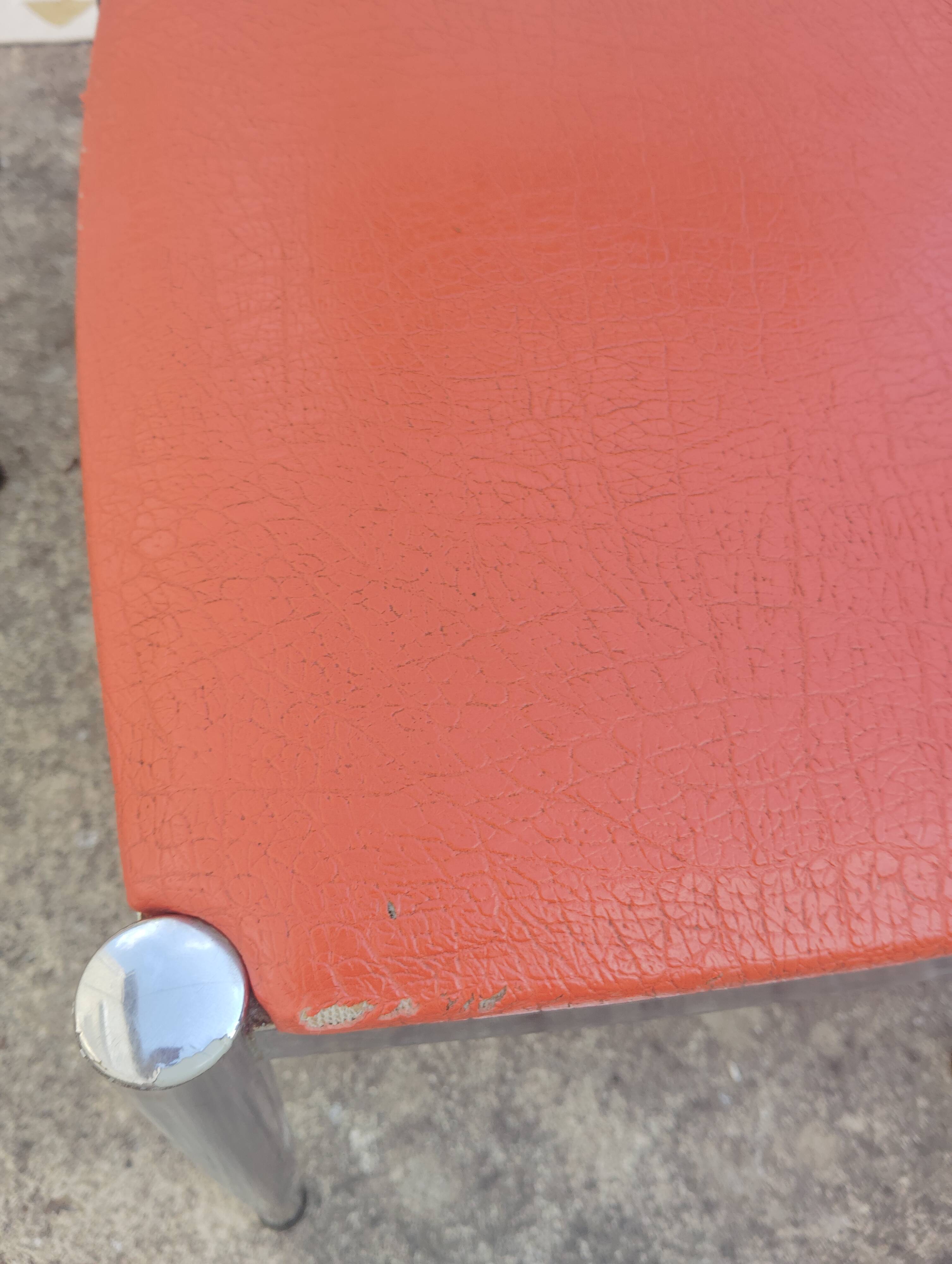 Set of 4 vintage chrome and orange faux leather chairs.