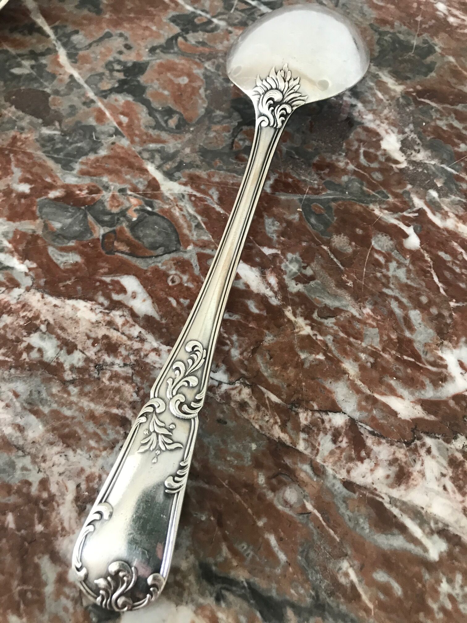 Set of 7 tablespoons in flowered silver metal with punch