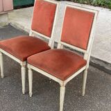 2 Louis XVI chairs in solid wood and orange velvet.