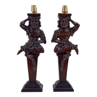 Pair of neo-Gothic lamps in carved wood "with jesters", France, XIXth
