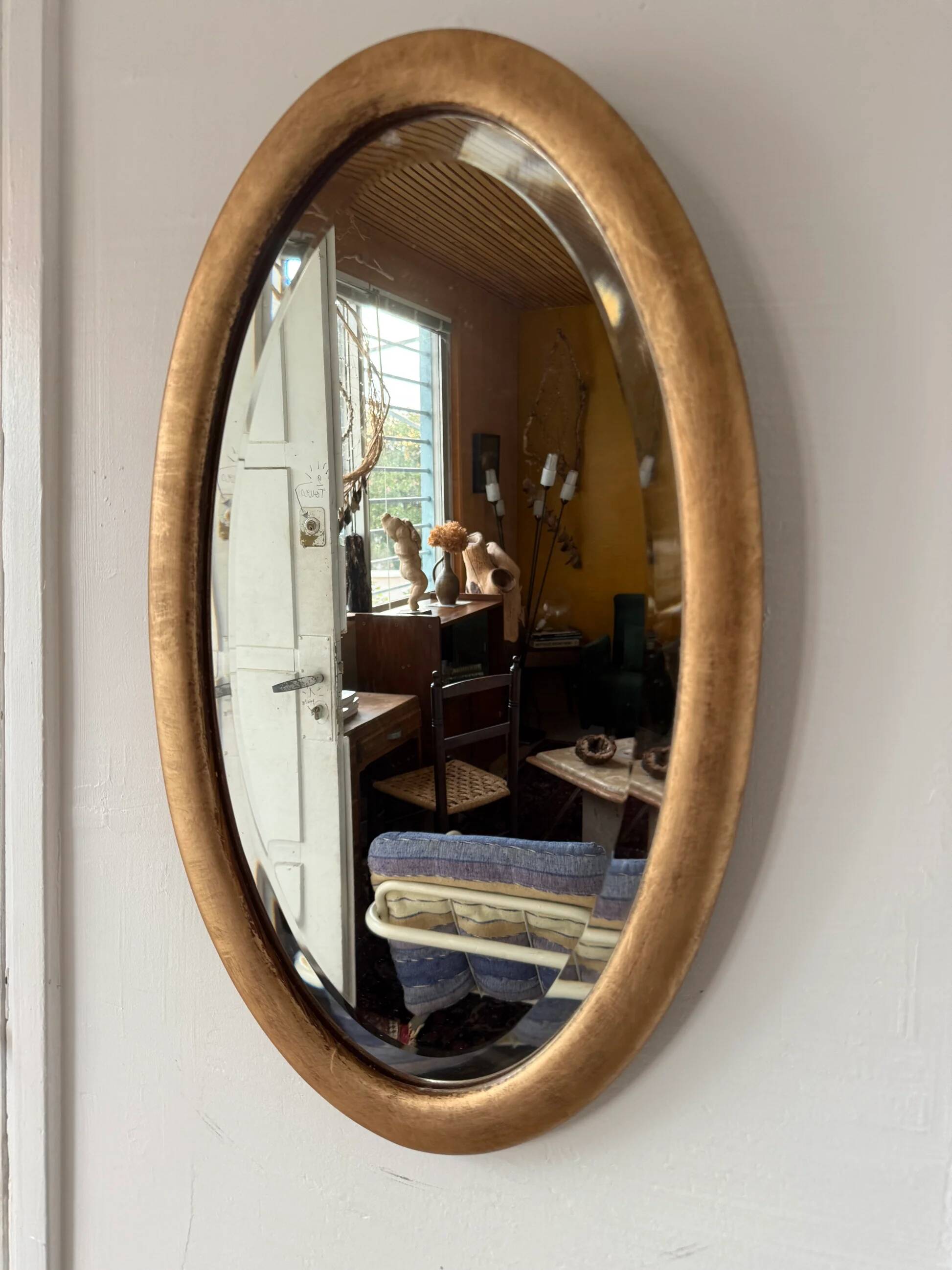 Miroir doré ovale ancien glace biseautée