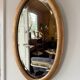 Miroir doré ovale ancien glace biseautée