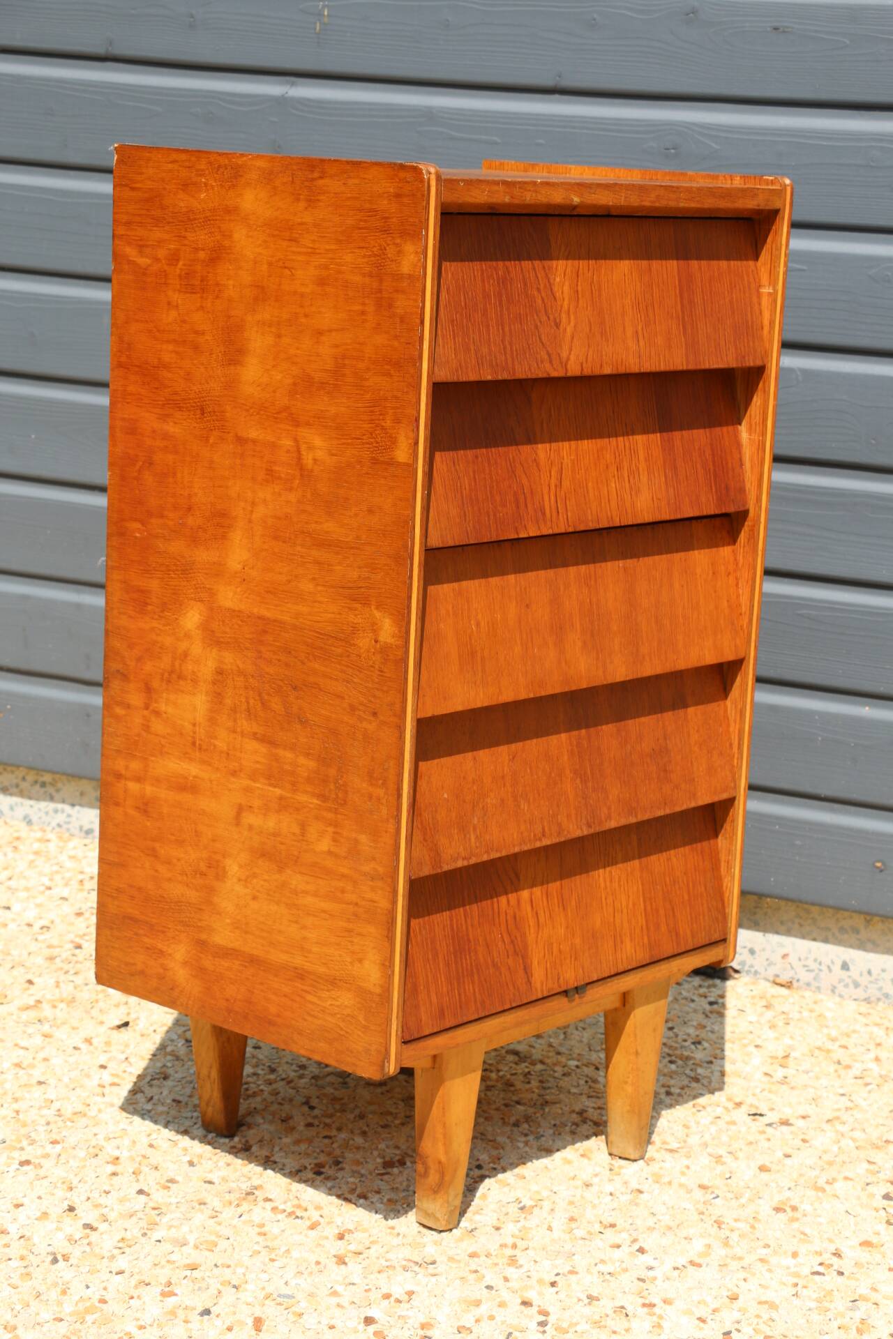 Dark chest of drawers with 5 drawers from the 1950s
