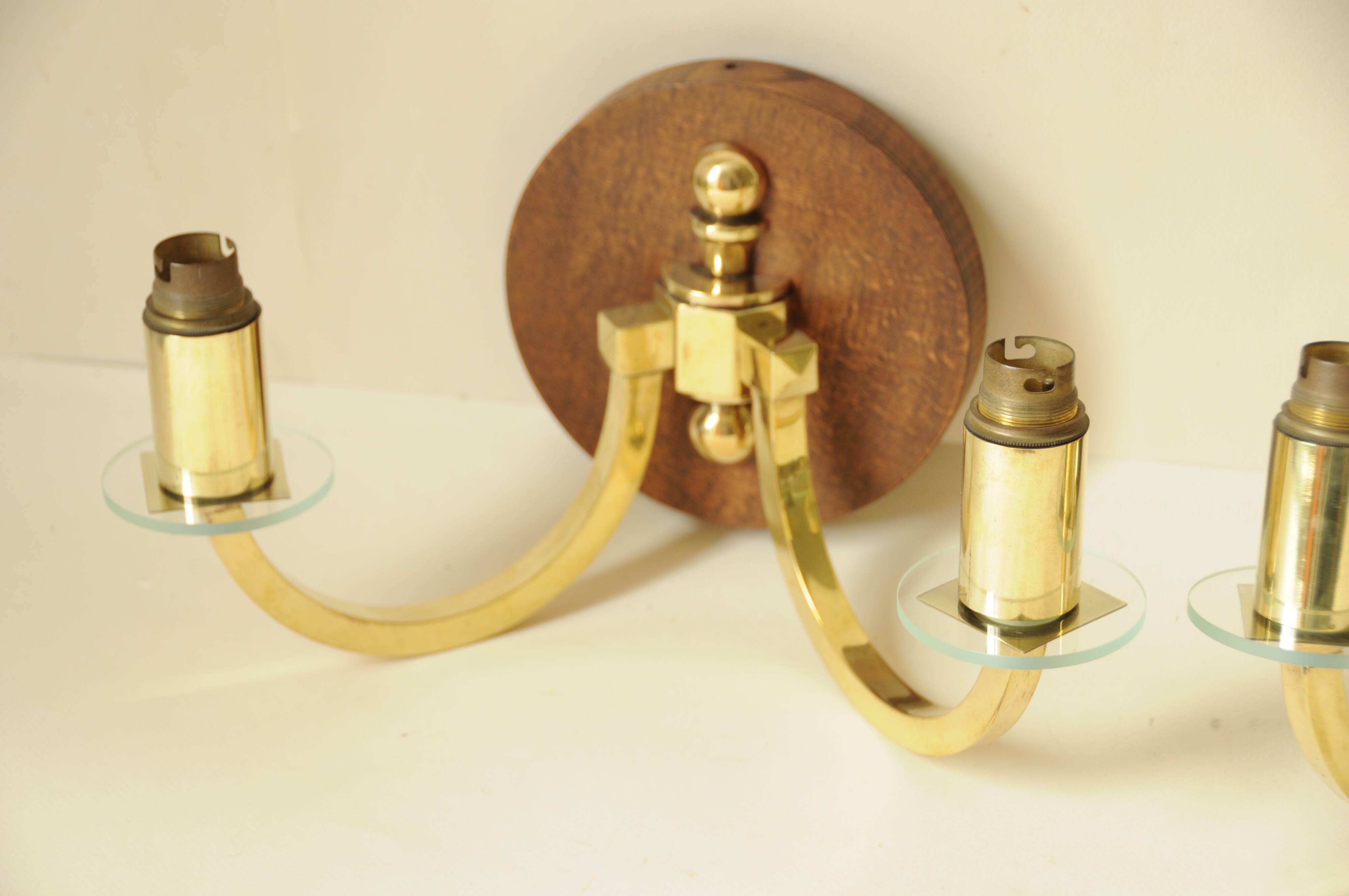 Pair of vintage wall sconces in polished gold brass, wood and glass