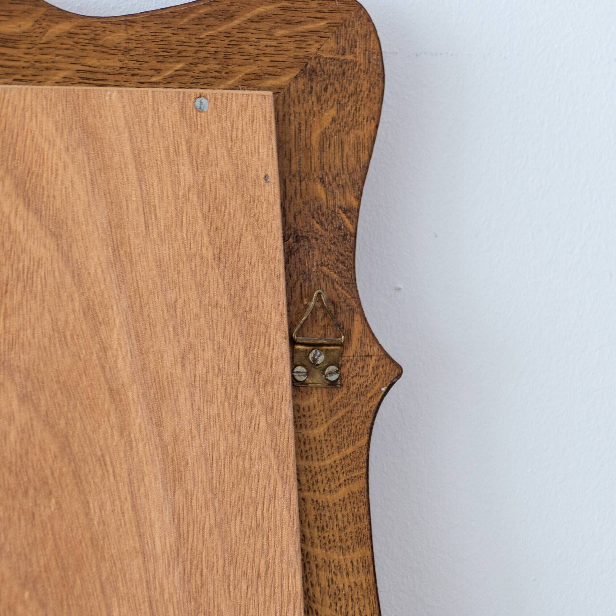 Very large vintage mirror in scrolled solid oak