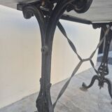 Antique cast iron and marble bistro restaurant table