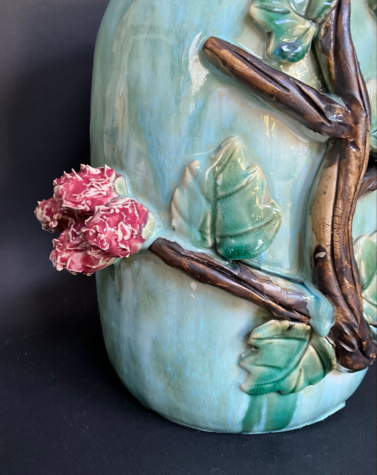 Large turquoise ceramic vase Athezza with raised floral decoration.