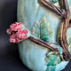 Large turquoise ceramic vase Athezza with raised floral decoration.