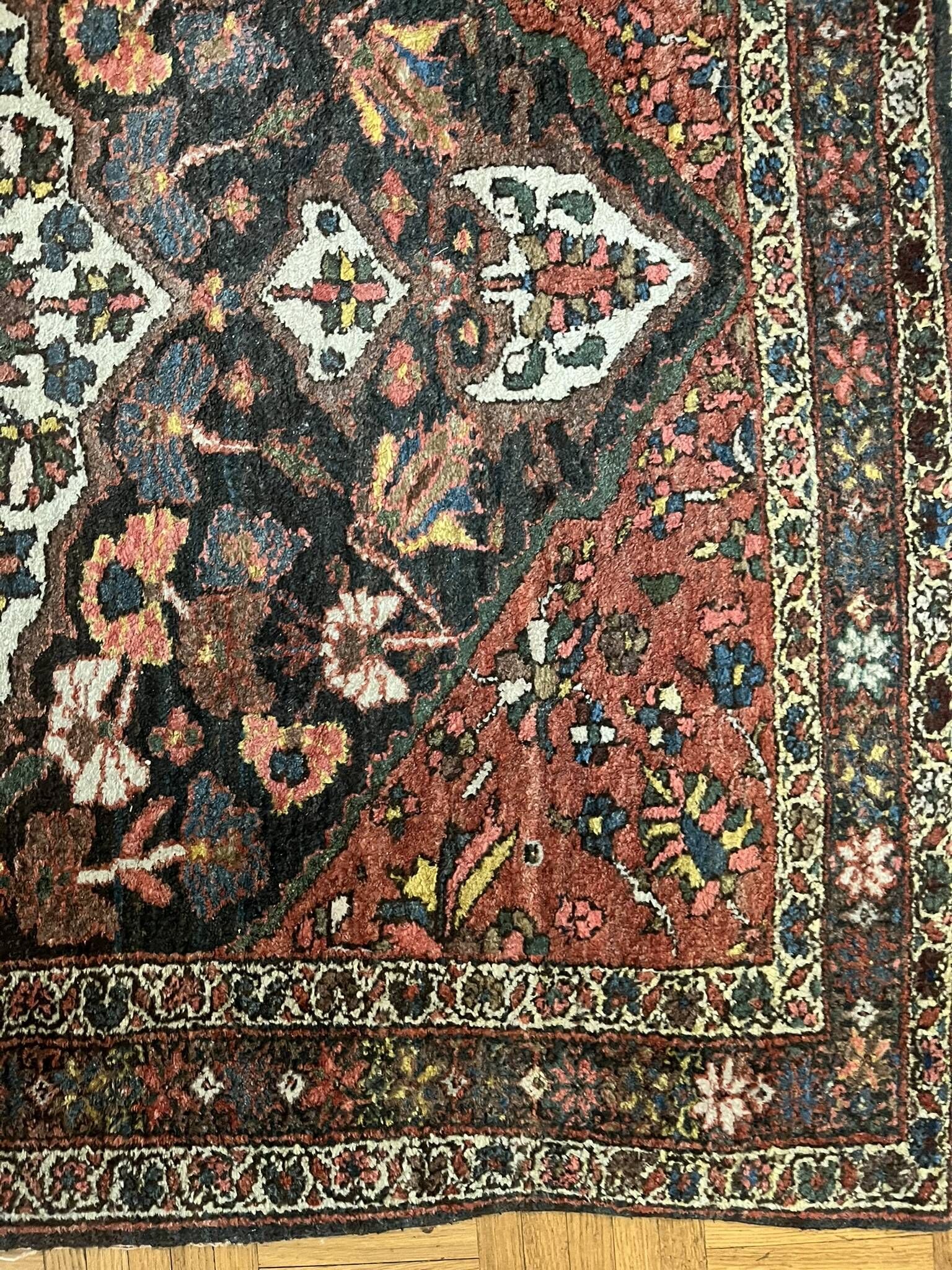 Antique handmade Hamadan Persian rug, ivory medallion on dark background 148x103.