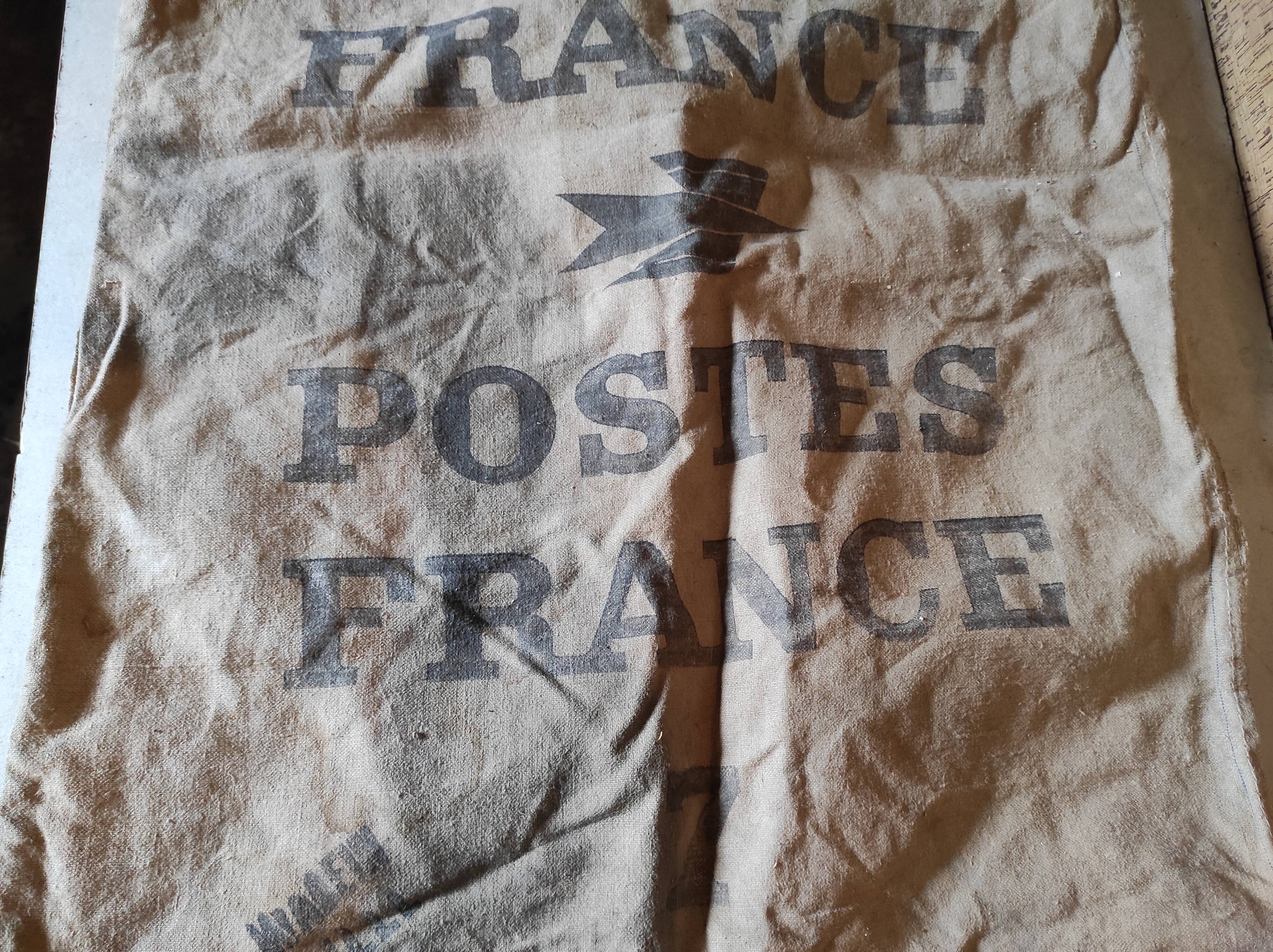 Vintage postal bag trade object of La Poste in mixed-race canvas burlap