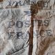 Vintage postal bag trade object of La Poste in mixed-race canvas burlap