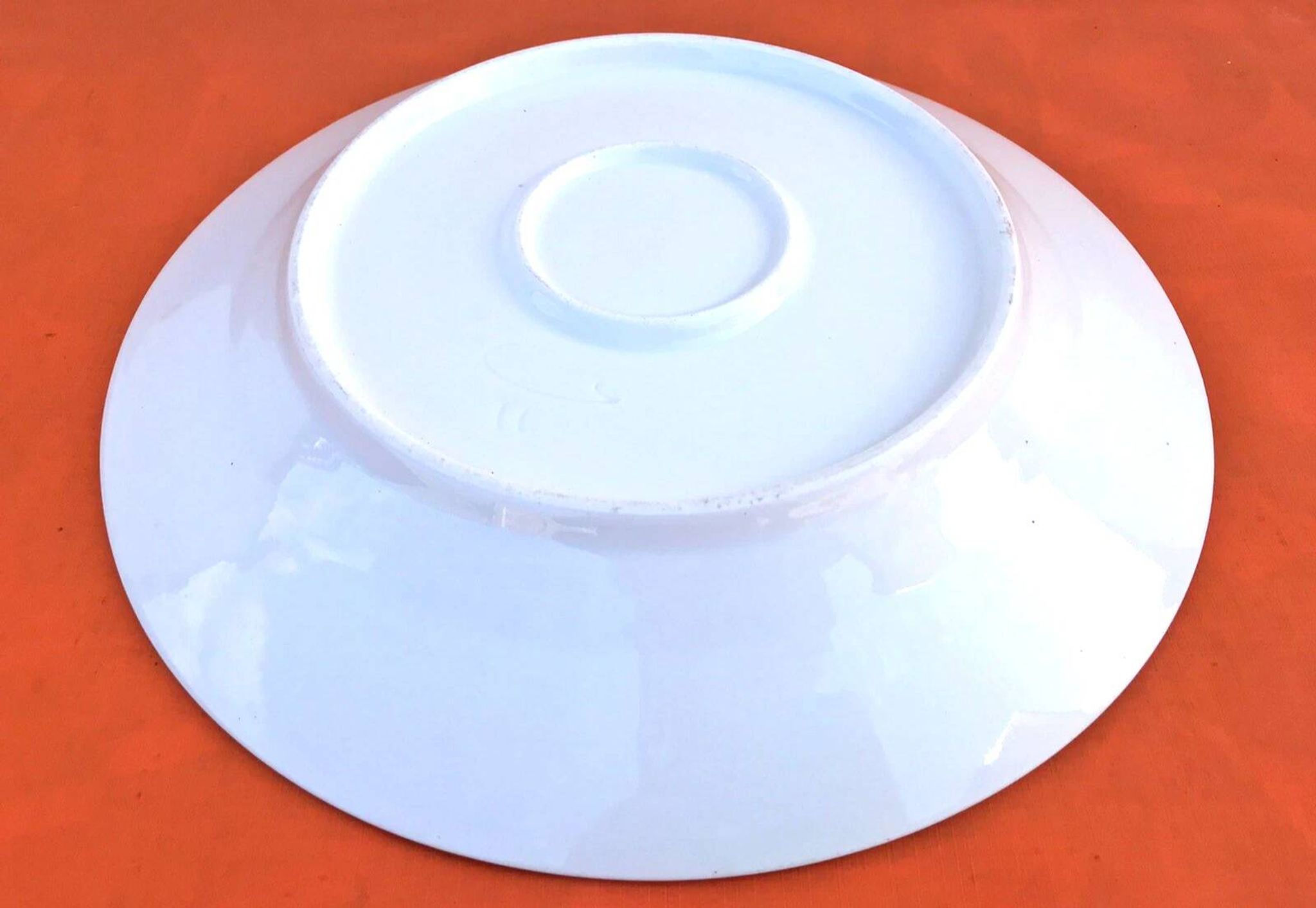 Antique white porcelain shallow dish with floral decoration.