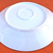 Antique white porcelain shallow dish with floral decoration.