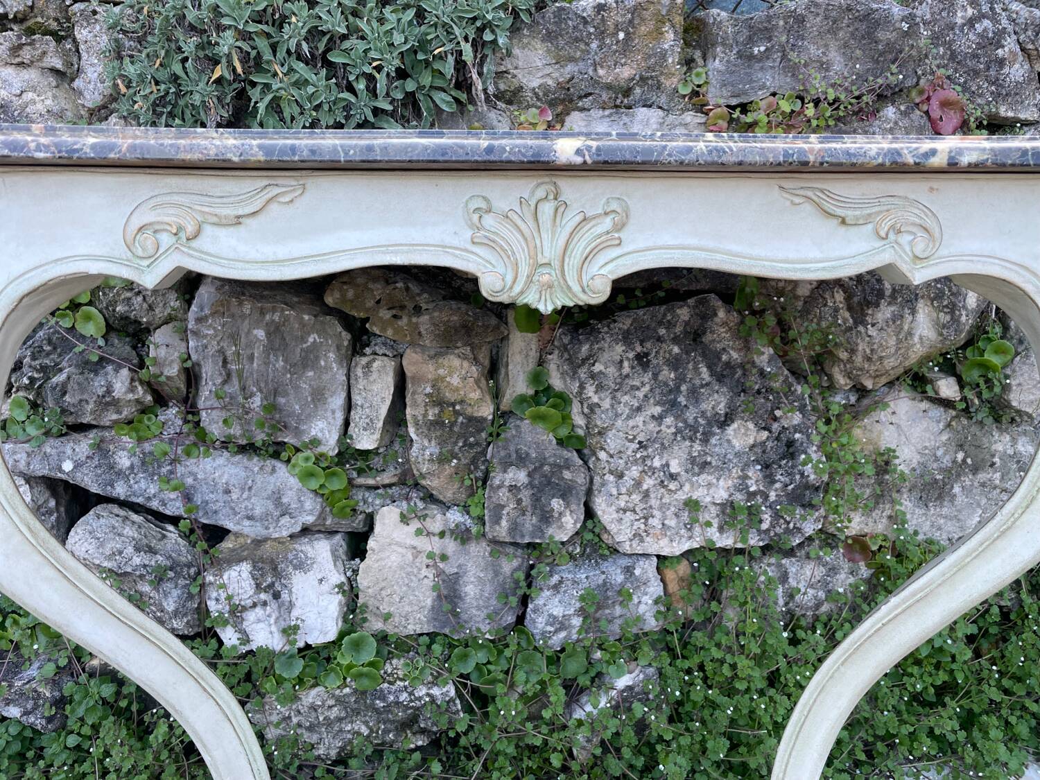 Wall console in painted, carved and molded wood in Louis XV style.