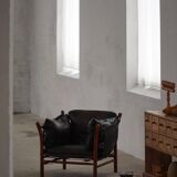 "Lounge chair 'Ilona' by Arne Norell in stained beech and leather, mid-20th century."