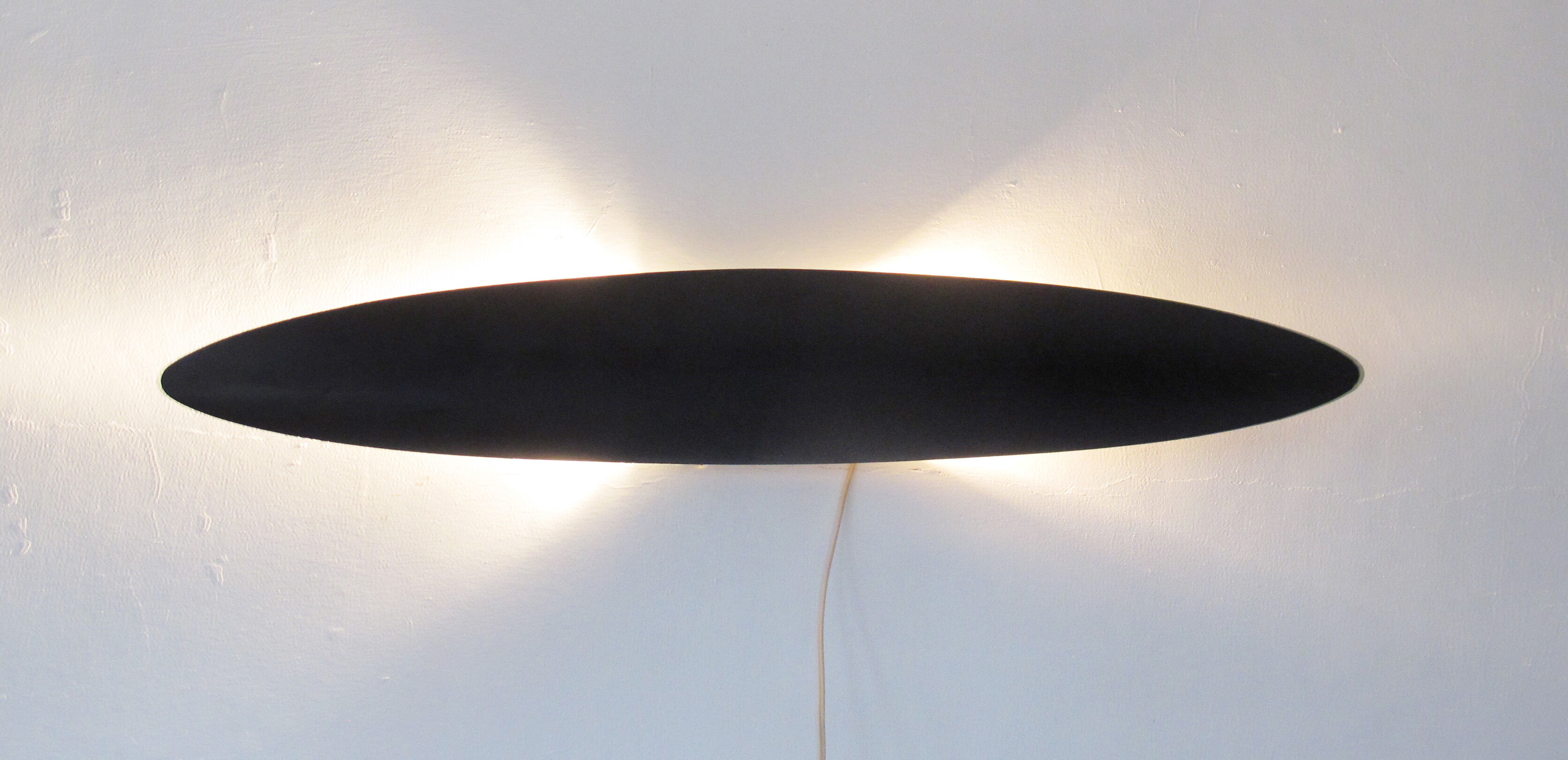 Applied in minimalist black stained wood