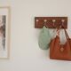 Wall-mounted coat rack with 4 ceramic hooks in blue and white, vintage style.