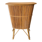Vintage rattan bar from the 60s with rounded shapes and a shelf for glasses