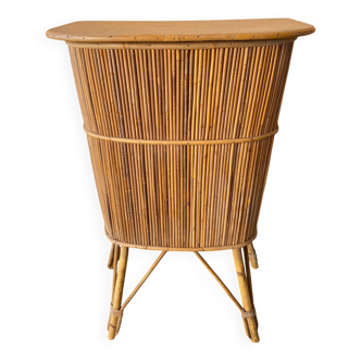Vintage rattan bar from the 60s with rounded shapes and a shelf for glasses