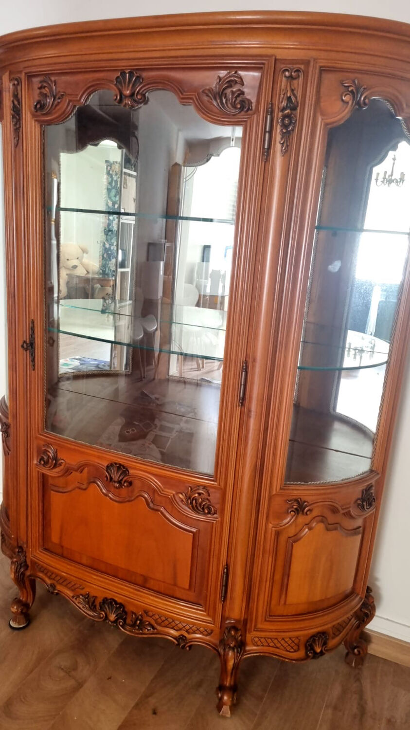 Silver display cabinet with a curved design.