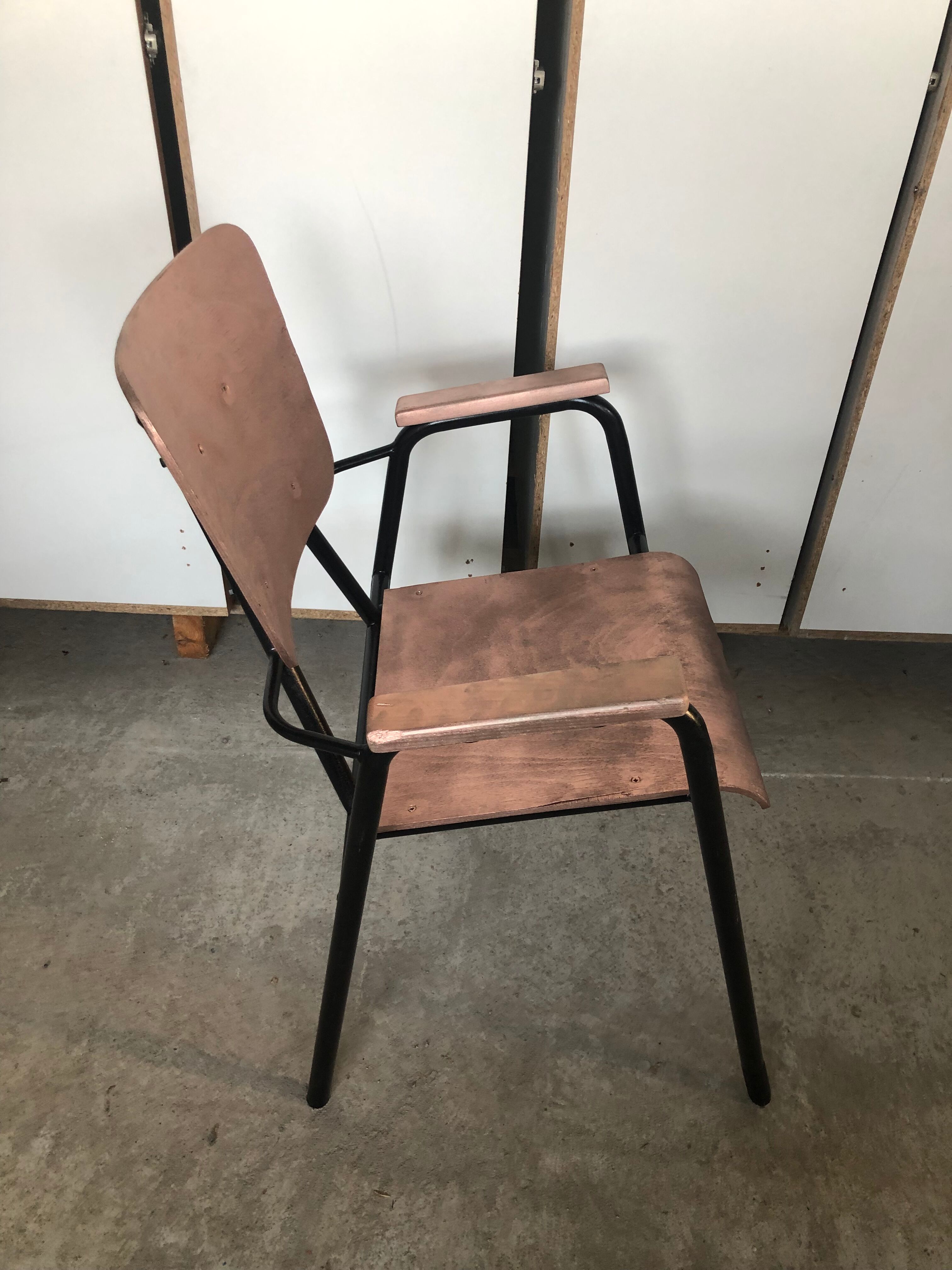 Old chair with armrest restored in metallic pink